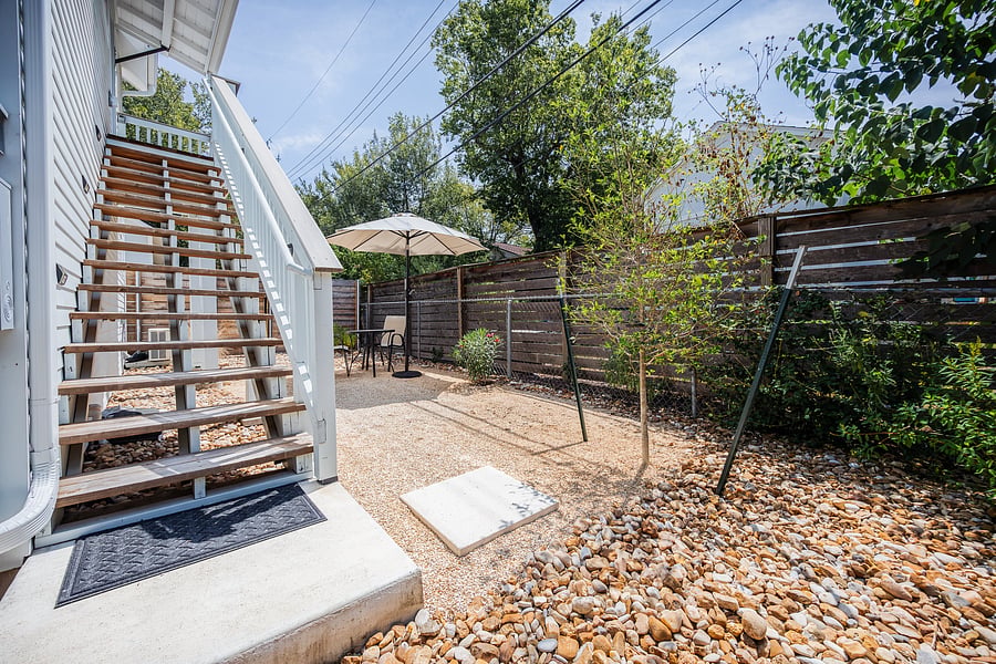 Private, fenced yard, with gated entrance. Yard maintenance included in rent.