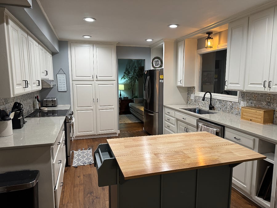 Kitchen: quartz countertops; two ovens, dishwasher, ample storage