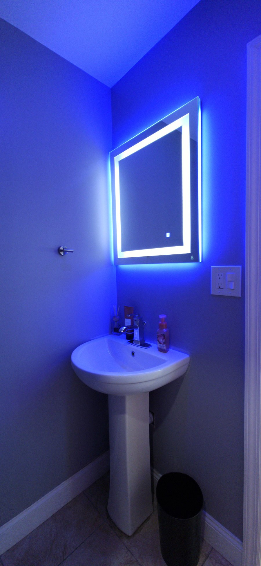 Modern vanity with LED backlit smart mirror and pedestal sink