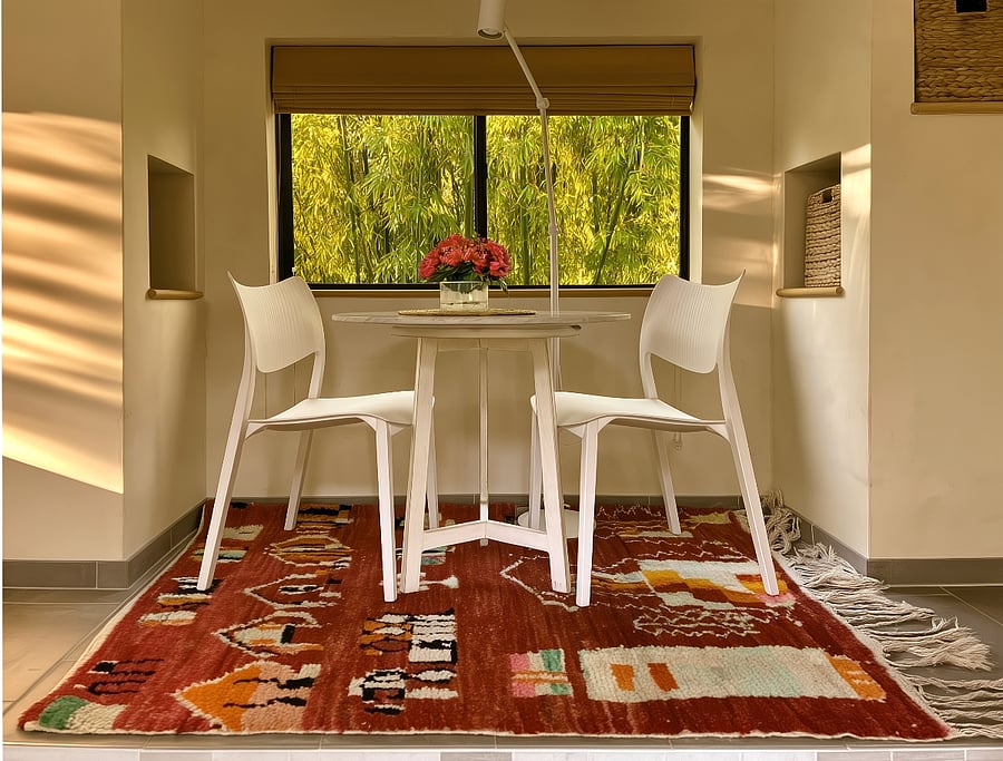 The cozy dining area which can be set up as a day bed if desired