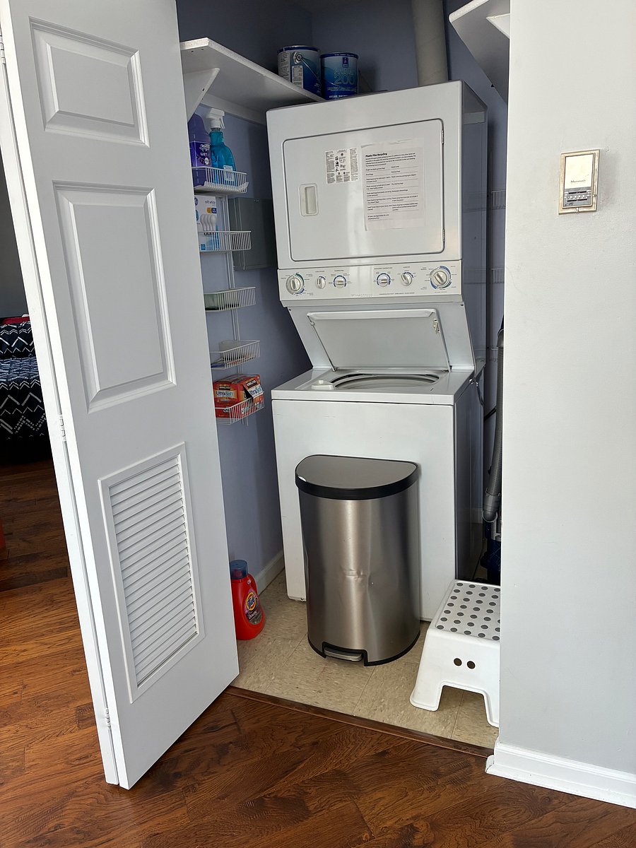 Stack washer dryer with storage