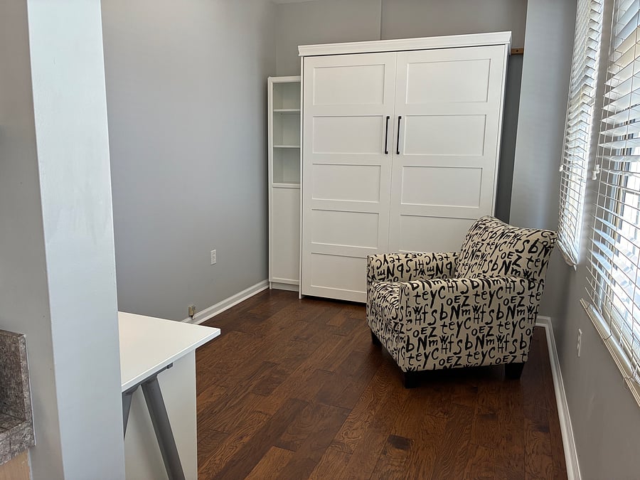 Closed up, the Murphy bed leaves room for an office.