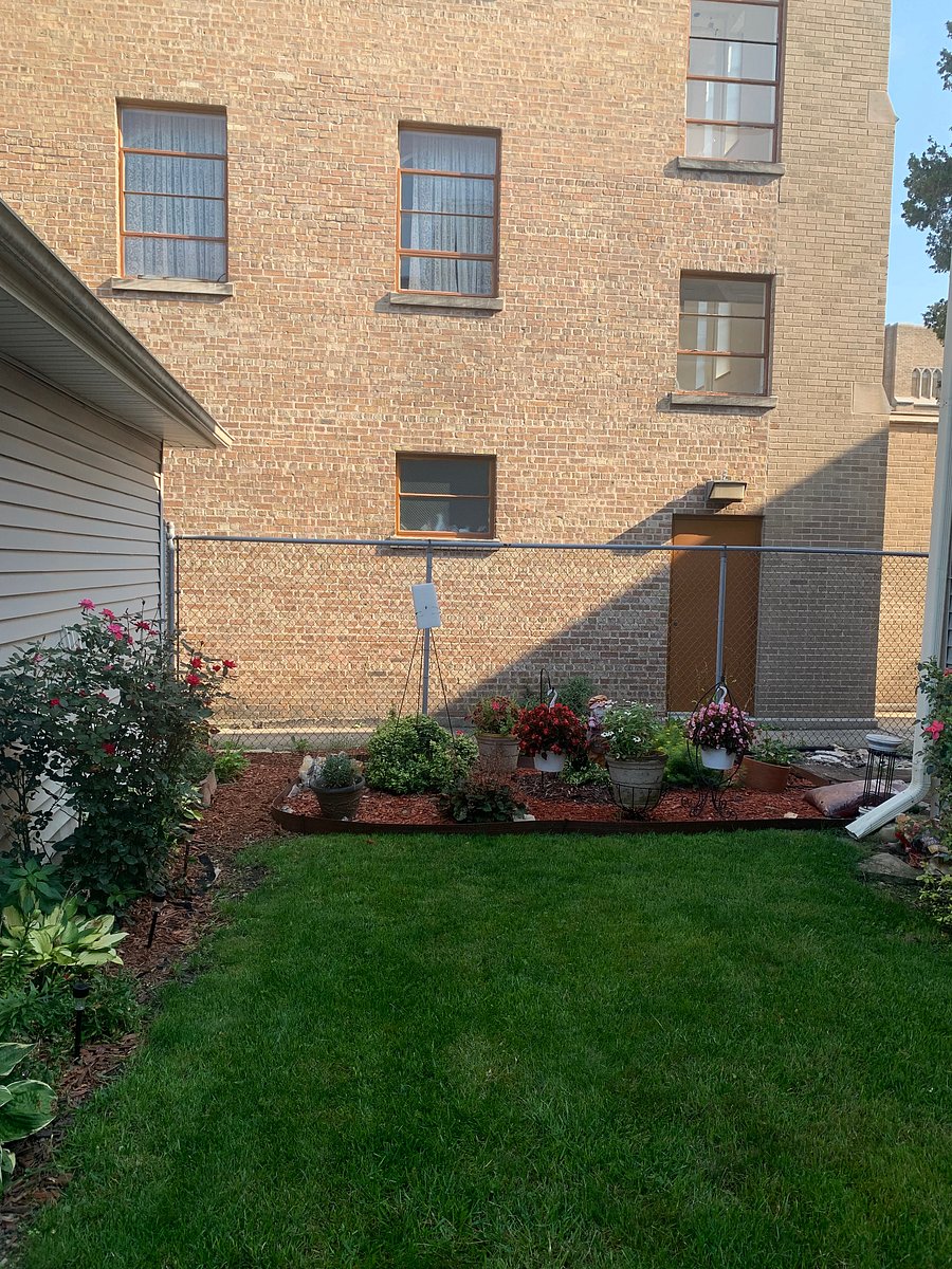 Beautiful flowered backyard to enjoy. You can see from upstairs back porch windows also.  