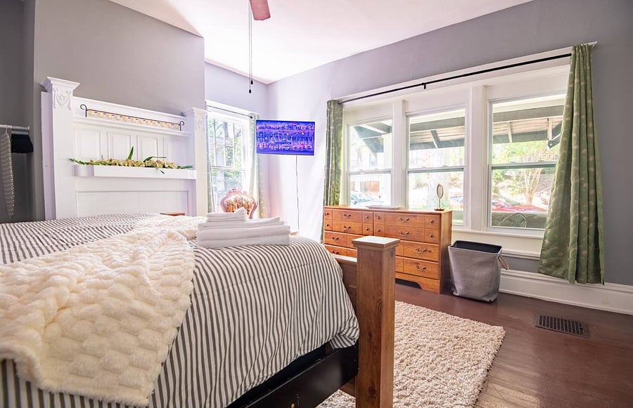 Enjoy a sunlit queen bedroom where natural light fills the room, giving you a calm and refreshing space to wake up in.