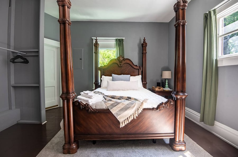 Further through the home, you can unwind on a queen bed designed for comfort, relaxation, and a restful night's sleep.