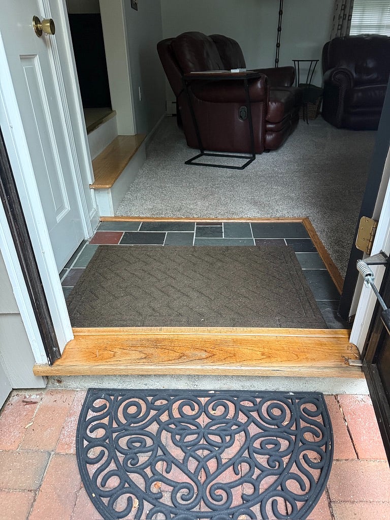 Entrance from driveway into house. One step into house.