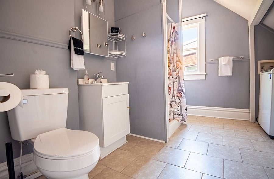 As you move through the home, you'll find a bathroom with polished tile flooring that gives you a clean, modern touch.