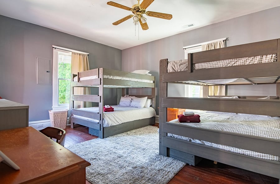 The 2 bunk beds in this fun, functional space are designed for comfort and convenience for families and large groups.