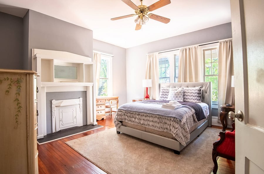 Wake up rested in this queen bed. Large windows fill the room with natural light, creating a warm and inviting space to start your day.
