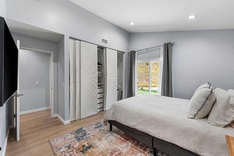 Primary bedroom with patio access