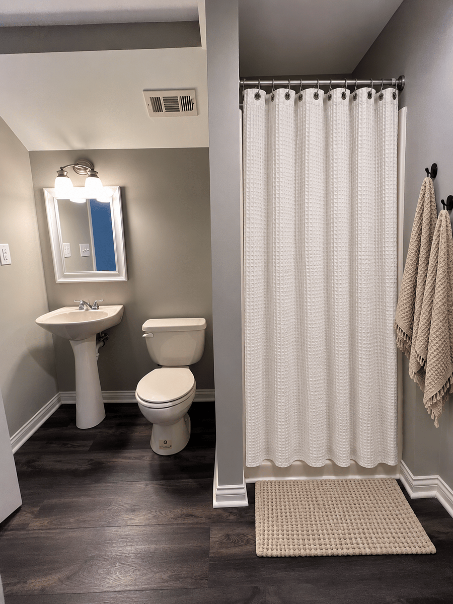 Private bathroom with stand up shower