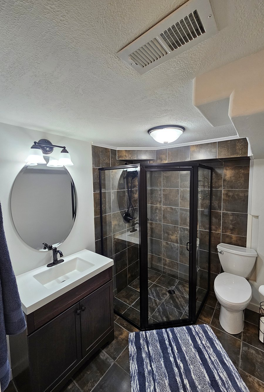 The bathroom with it's large modern shower.