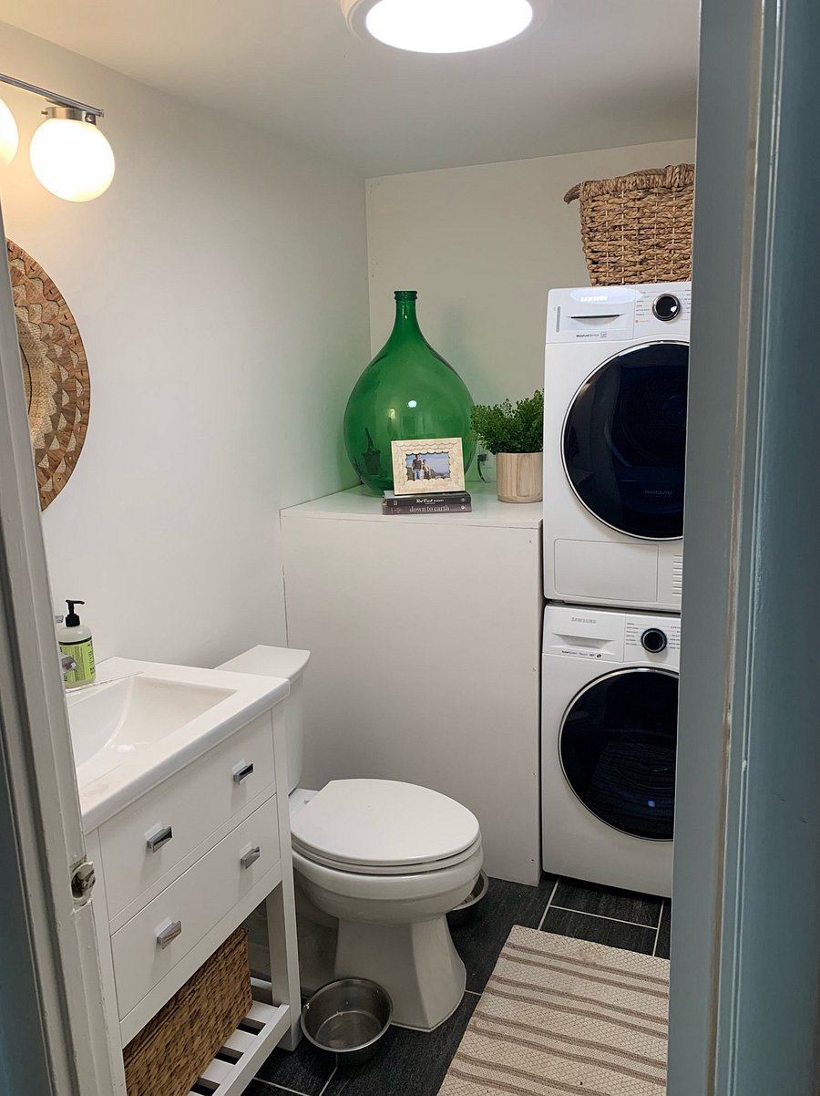 Stackable washer and dryer in the half bath.