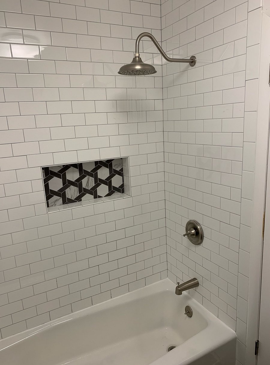 Tub and rain head shower.