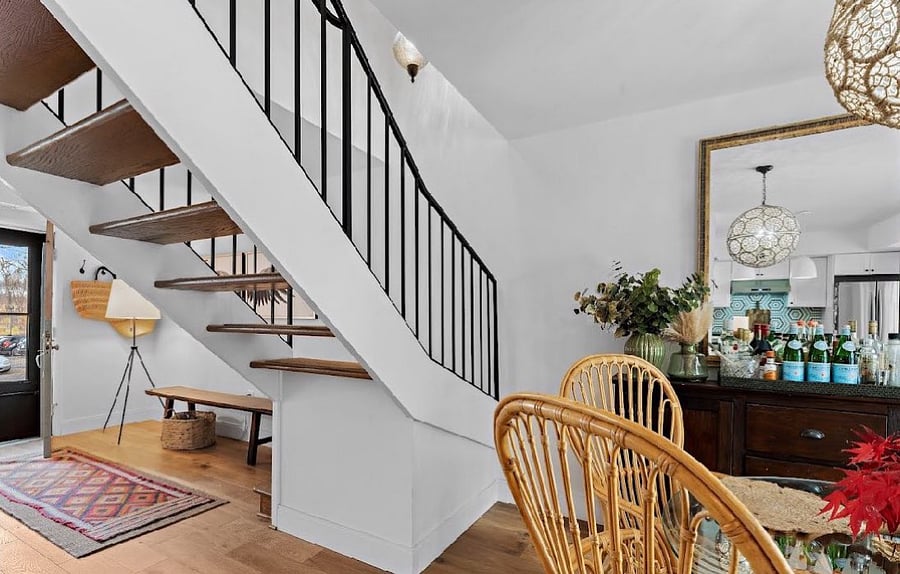 Open staircase gives the main level a very modern feel.