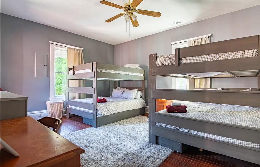 The 2 bunk beds in this fun, functional space are designed for comfort and convenience for families and large groups.