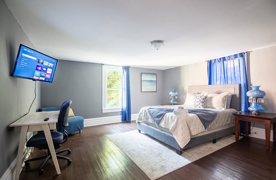 Wake up refreshed in this cozy queen bedroom, complete with a TV for winding down, plenty of dresser space, and a closet to keep everything neatly tucked away during your stay.
