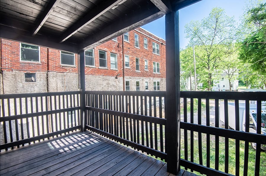Step out back and enjoy a quiet moment on the rear porch-an easy spot to catch some fresh air, sip your coffee, or unwind after a day around the city.