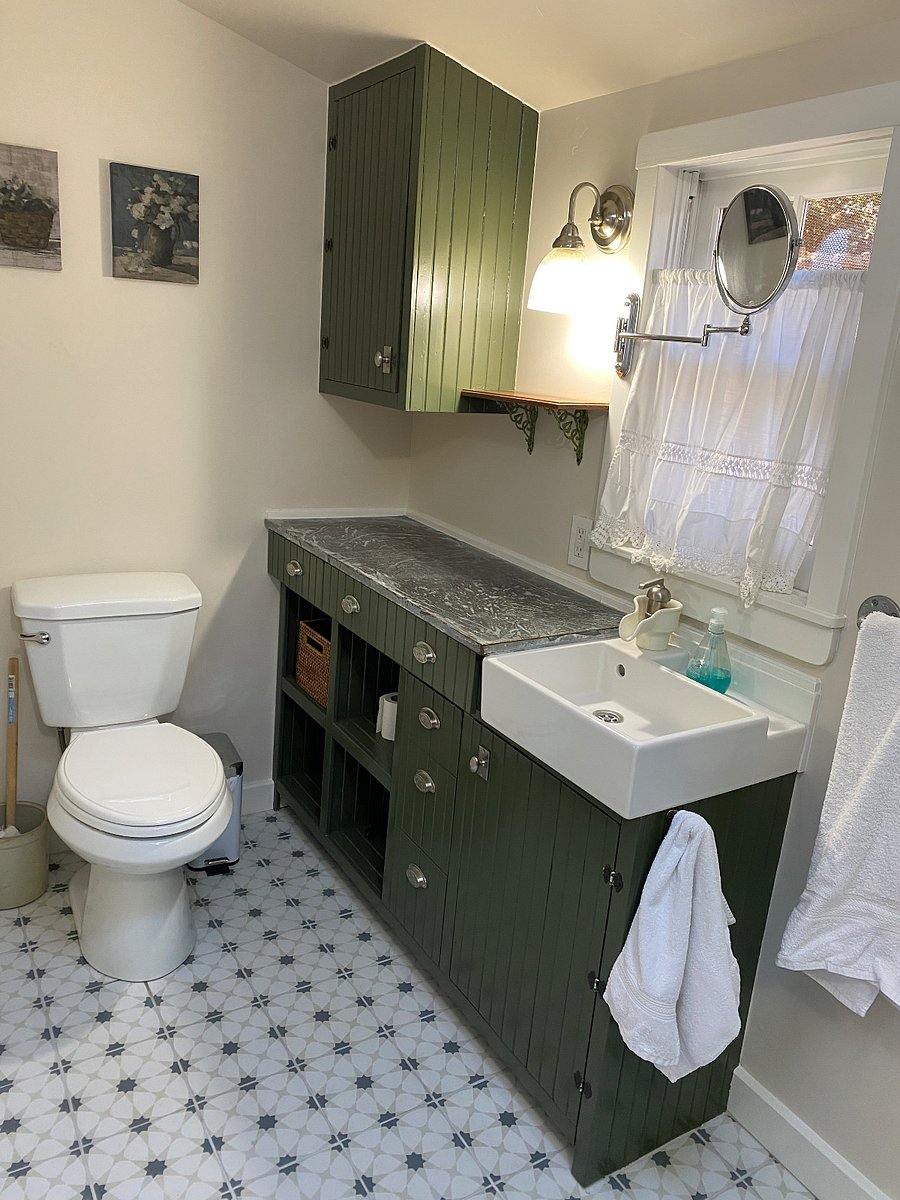 The bathroom with cupboard and counter space.  On the wall opposite this photo, there is a wall medicine cabinet.  