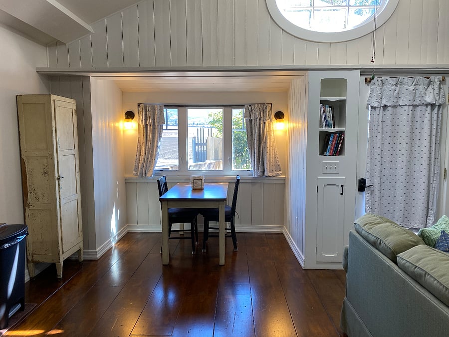 This photo is taken with the bed and bathroom behind me.  The dining table is in a little nook and has perfect views of the fields and the Santa Lucia Mountain Range. 