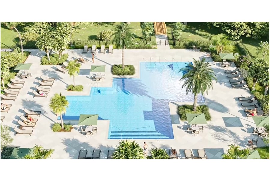 A resort-inspired oasis | A swimming pool with towering palm trees offers the ultimate summertime retreat, perfect for enjoying the sunny Florida weather. Bathe in the sun or relax in the shade underneath the beautiful Chickee hut.