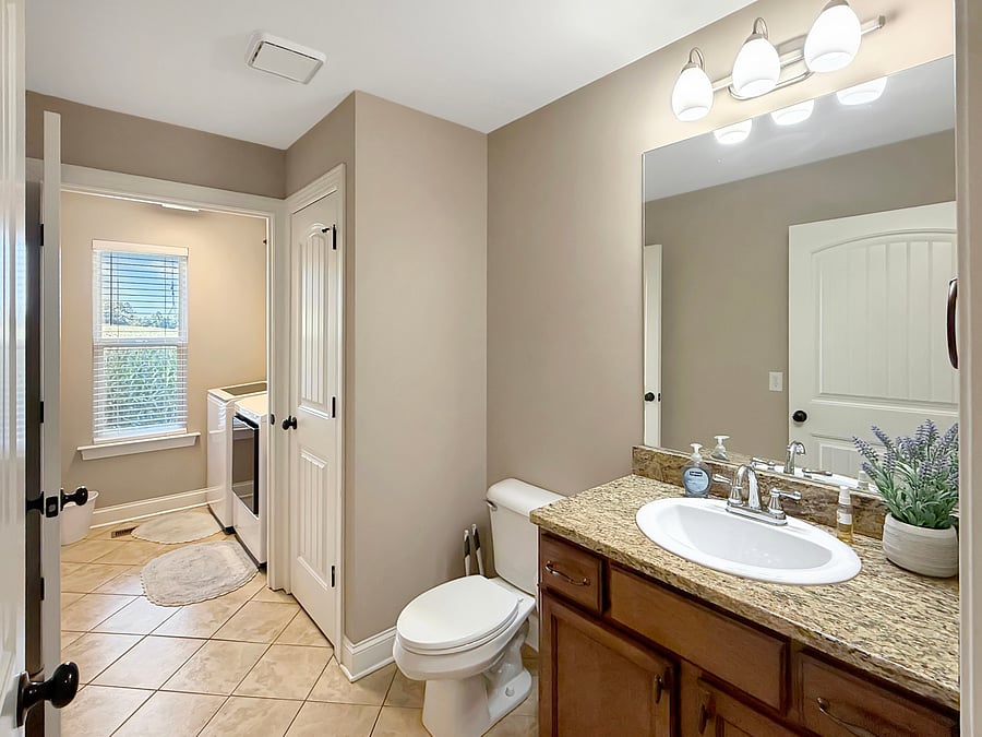 Laundry room and 1/2 bath located on 1st floor