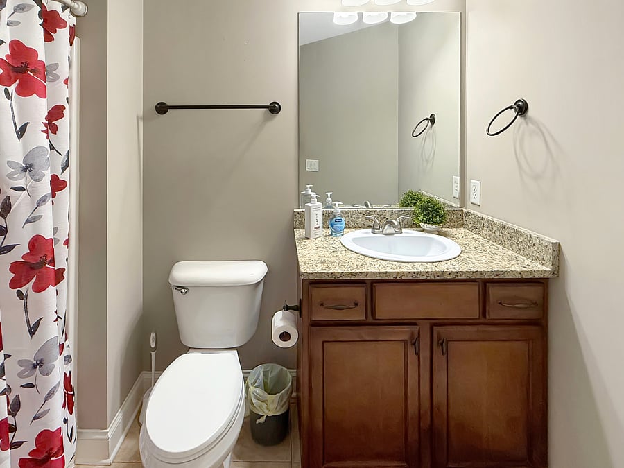 Additional full bath located in hallway near the two additional bedrooms
