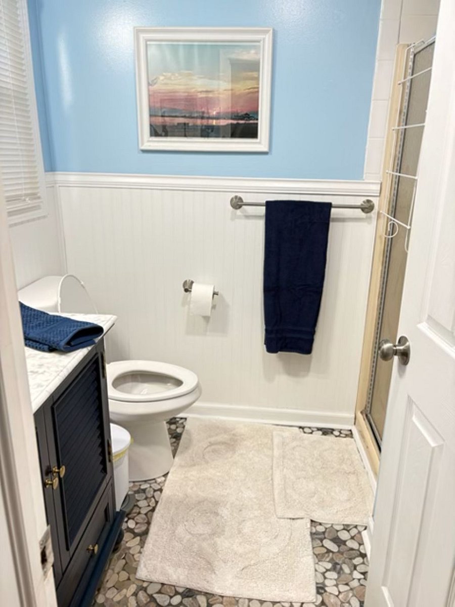 First floor bathroom with shower and laundry units.