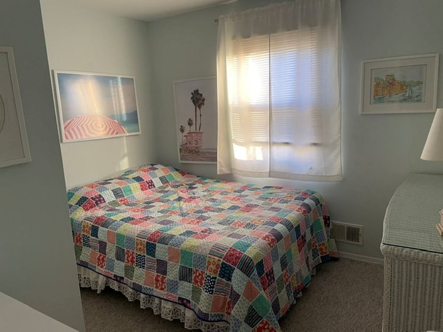 Queen bedroom with large closet and portable work station.