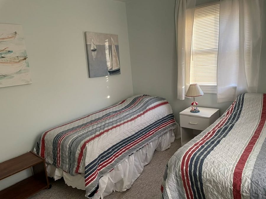 Double and twin bedroom with large closet and portable work station.