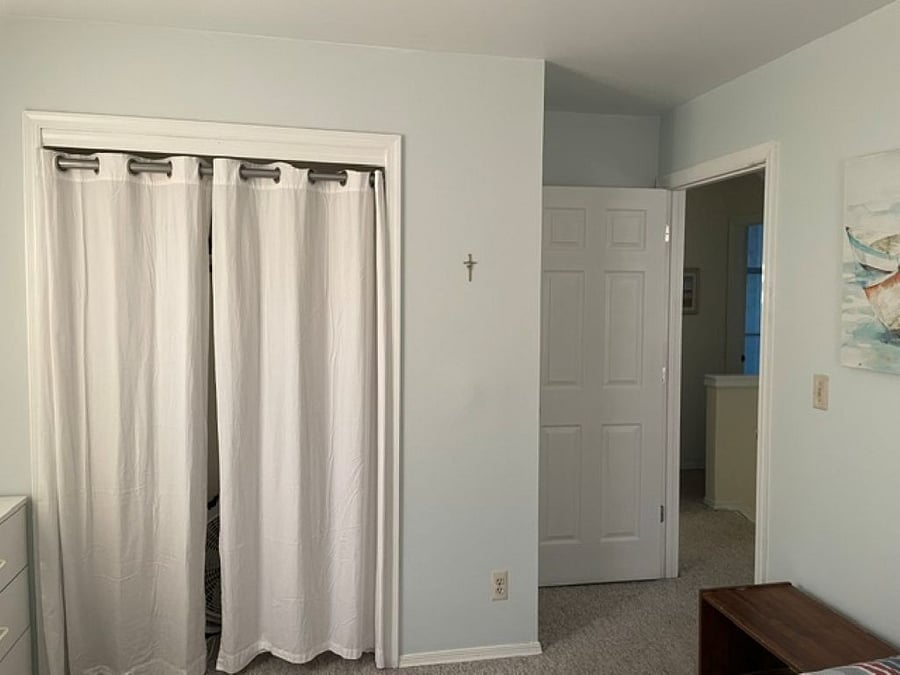 Double and twin bedroom with large closet and portable work station.