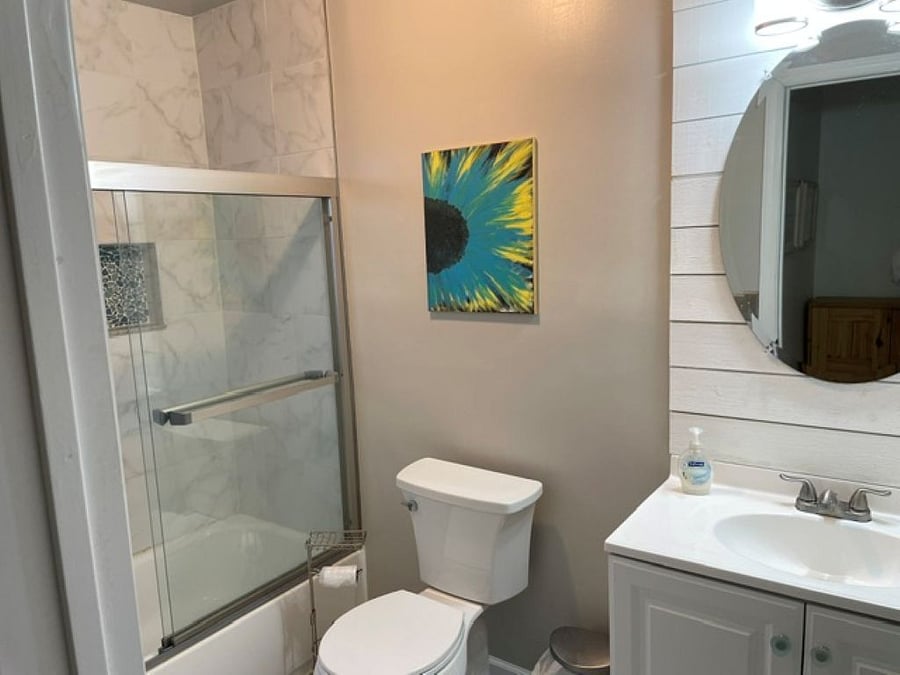 Second floor bathroom with tub/shower and closet.
