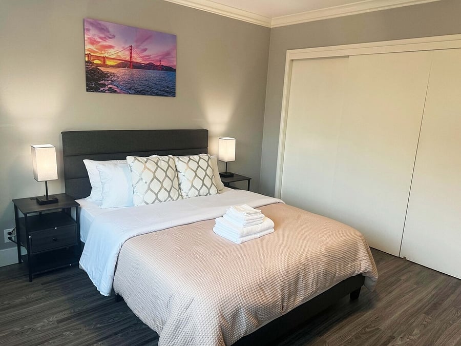 Room 2: Queen bed with nightstands and closet
