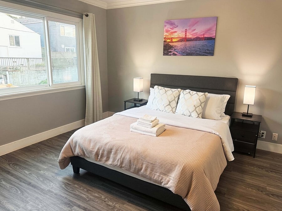 Room 2: Freshly made bed with clean linens and towels provided