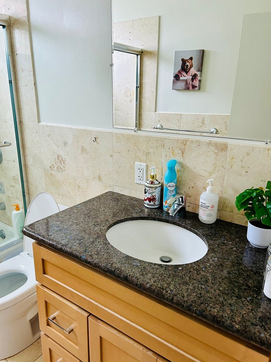 Clean bathroom with granite vanity