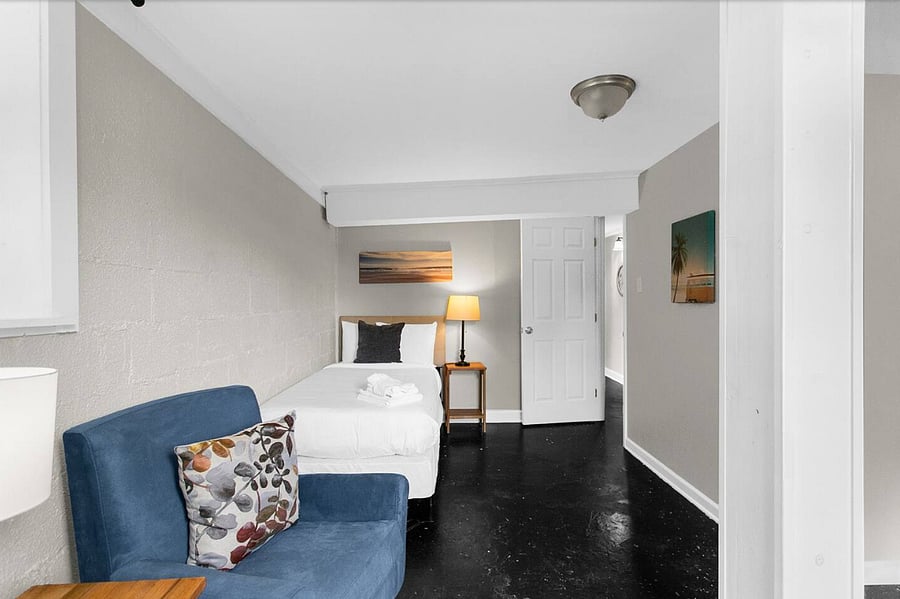 Enjoy a versatile twin bedroom featuring a cozy sitting area-perfect for relaxing, reading, or taking a quiet break from the group.