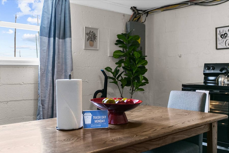 Bring everyone together at the farmhouse-style table, seamlessly connected to the kitchen for easy dining and conversation.