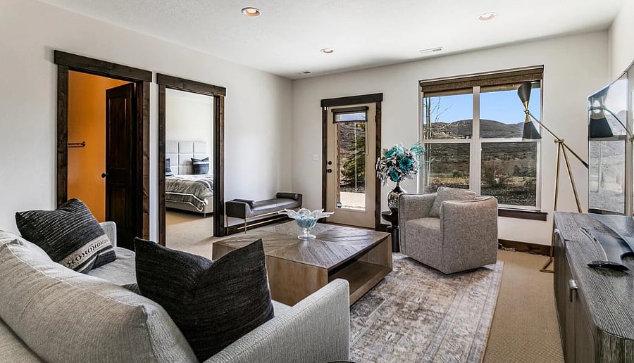Family suite has a bedroom with queen size bed, full bath and living room. Goes directly to deck.