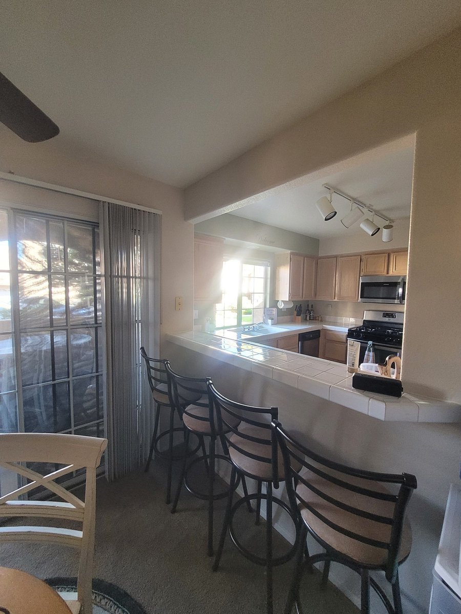 Bar area off kitchen provides sitting for meals and/or work