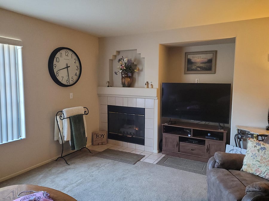Peaceful living room with fireplace, windows, comfortable couch and stuffed chairs to relax and unwind
Living Room 2 of 3