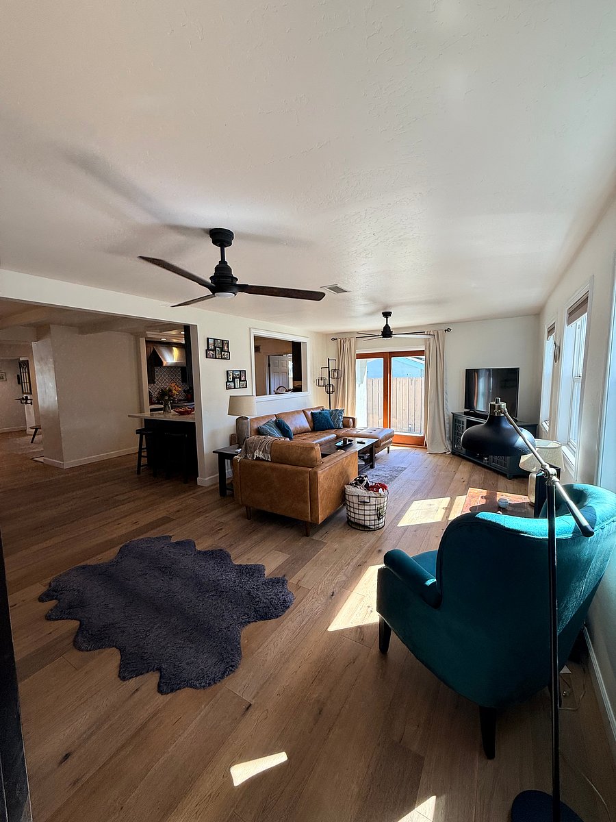 Back living room, which has a large opening from the kitchen so you can view the TV from the kitchen. Sliding glass doors give access to the backyard. All brand new couches
