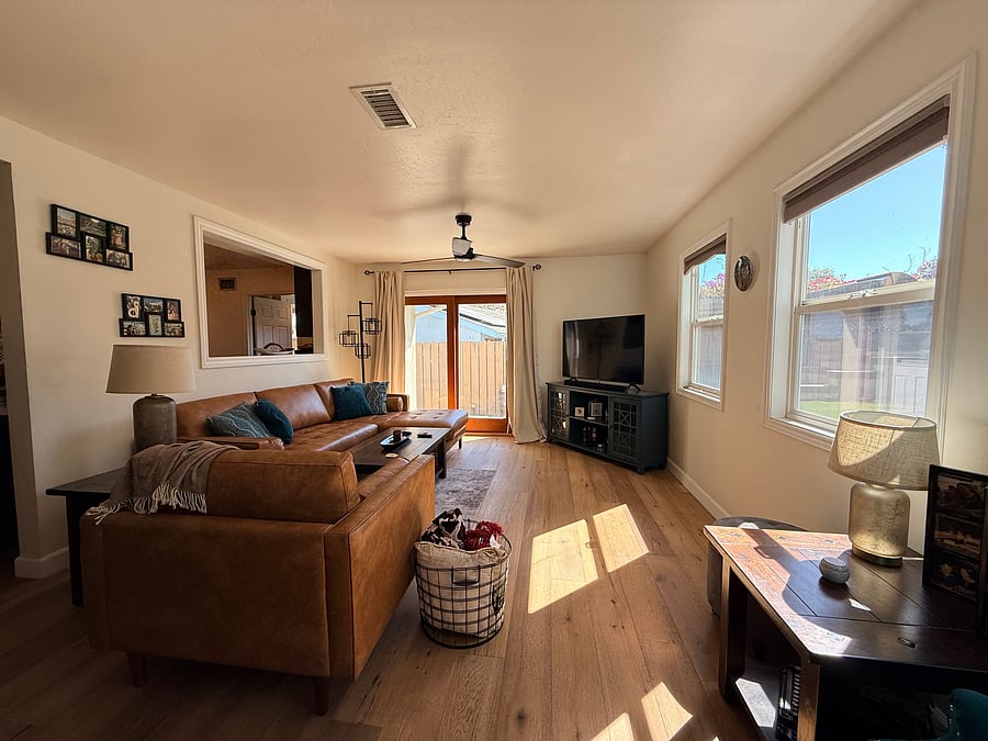 Closer view of back living room, with view on the terraced backyard.