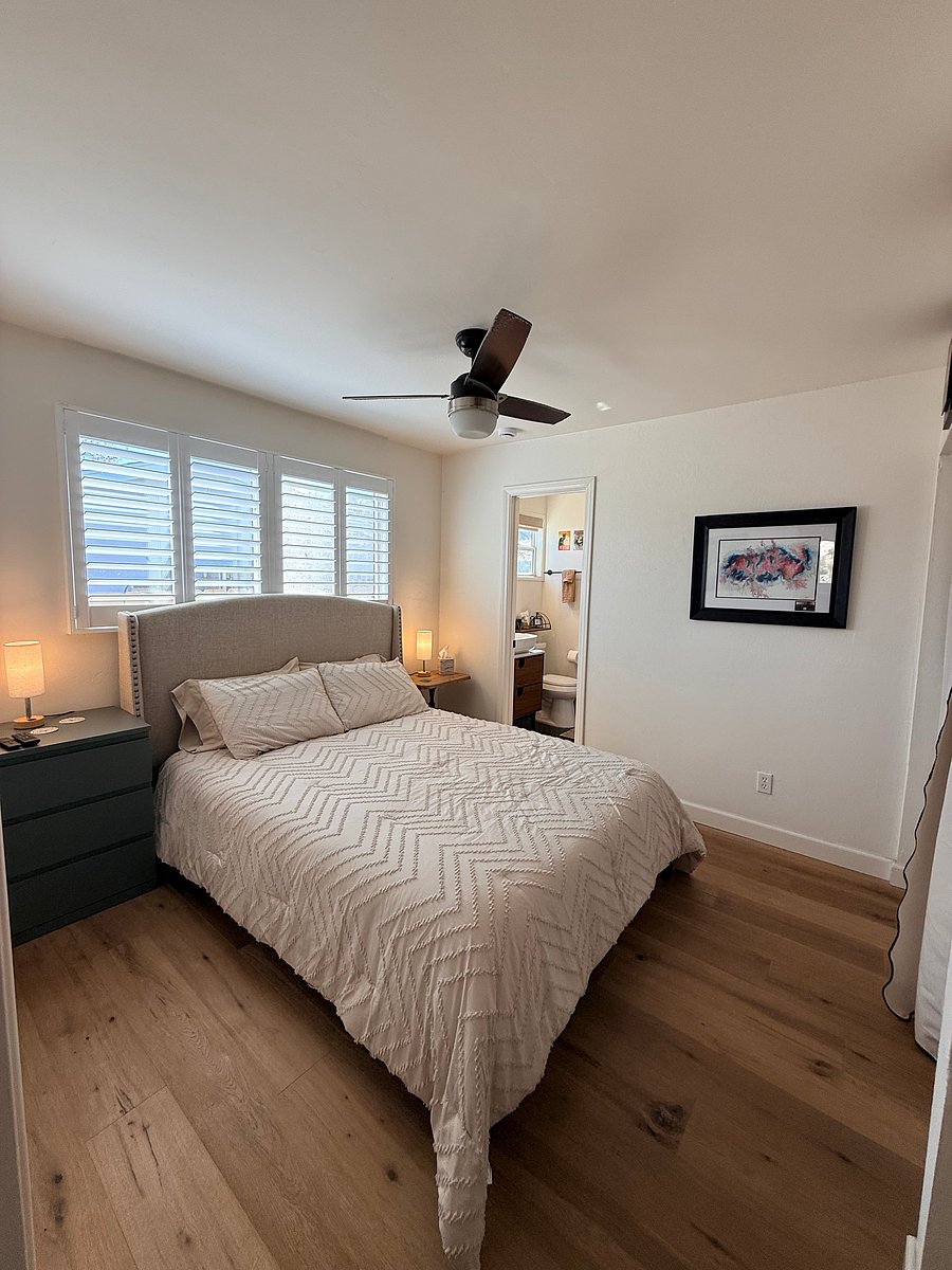 View of room available from opposite side. Very comfortable queen mattress with all brand new linens, pillows, and comforter. Brand new 3-drawer nightstand and matching 5-drawer dresser (not visible in this picture).