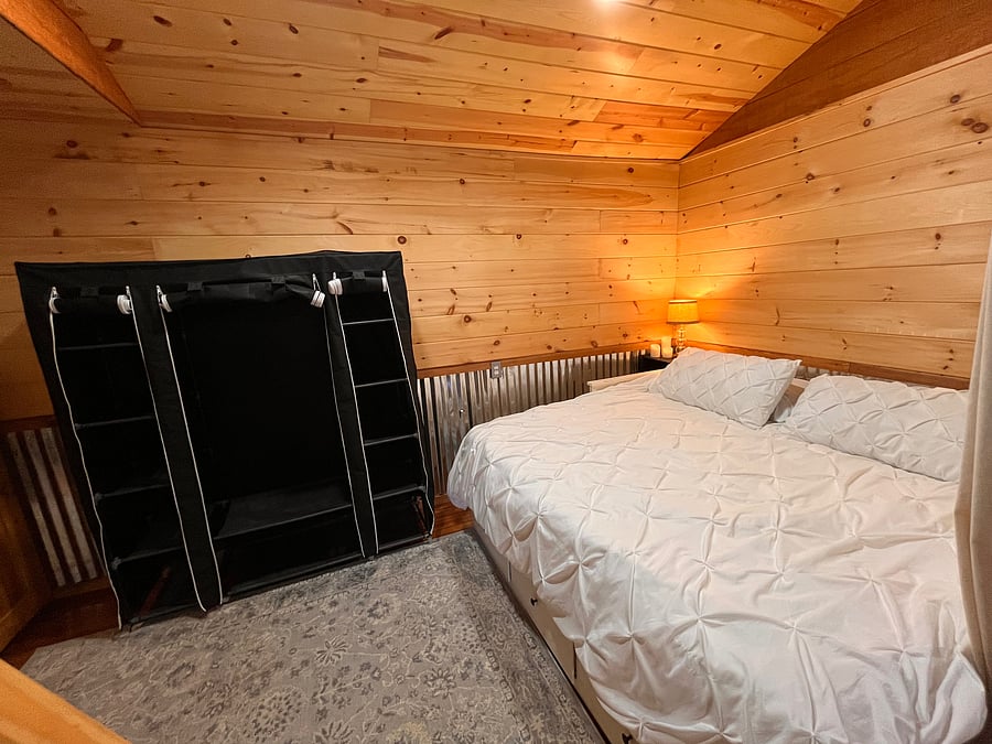 King size bed on main floor
And hanging clothes closet. Full size solid wood dresser also in room
