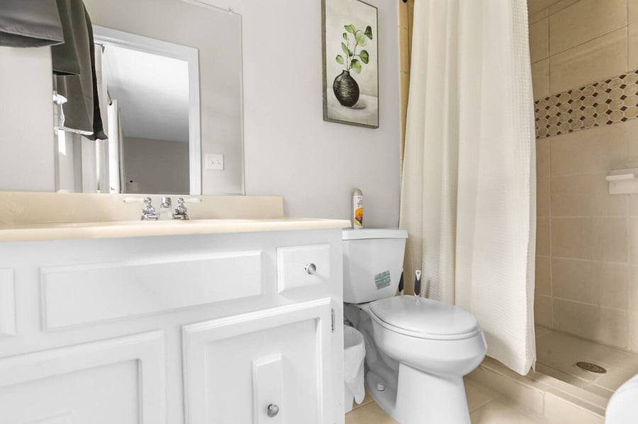This upstairs bathroom features a clean, modern walk-in shower, offering a bright and refreshing space to start or end your day with ease and comfort.