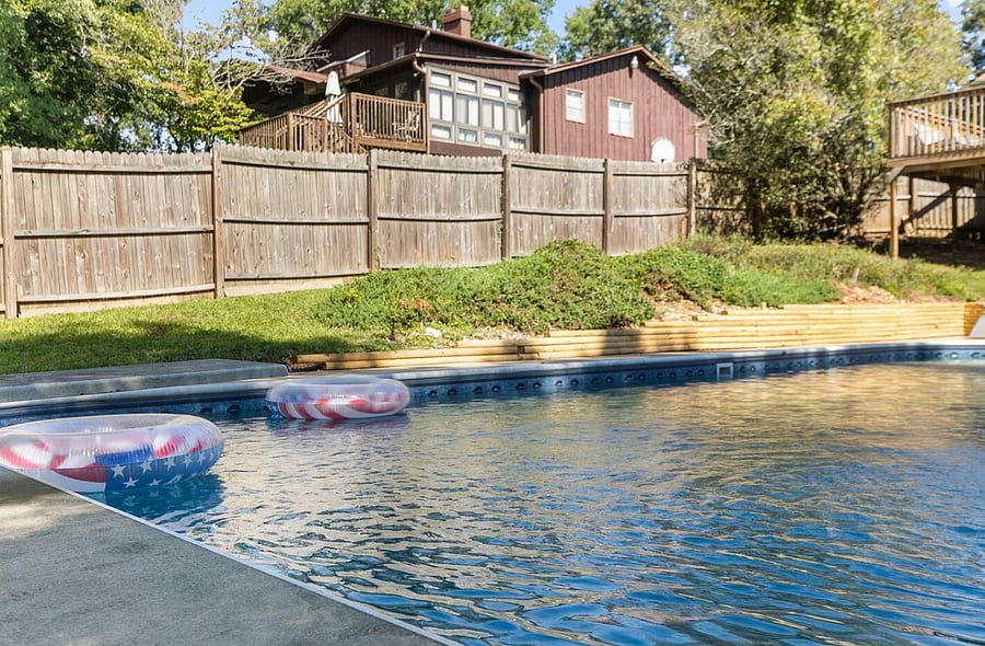 The expansive backyard adds to the experience, giving you room to move between the pool, lounging areas, and open green space without ever feeling crowded.