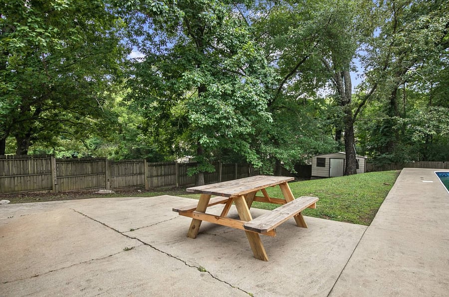 Gather around the picnic table for casual meals, morning coffee, or late-night conversations under the open sky. It's the kind of simple, shared space that turns everyday moments into something a little more memorable.