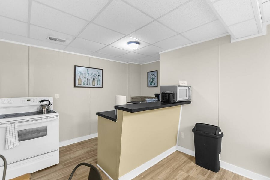 Located just off the downstairs living area, this kitchen creates a seamless flow between cooking, dining, and relaxing. It's an ideal setup for groups who appreciate having extra space to gather and share meals.