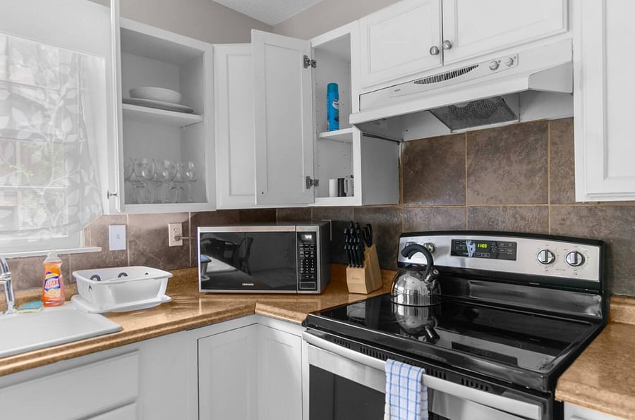 Whether you're cooking for a group or just grabbing a quick bite, this kitchen offers a seamless experience-complete with coffee to get you going and everything you need within reach.