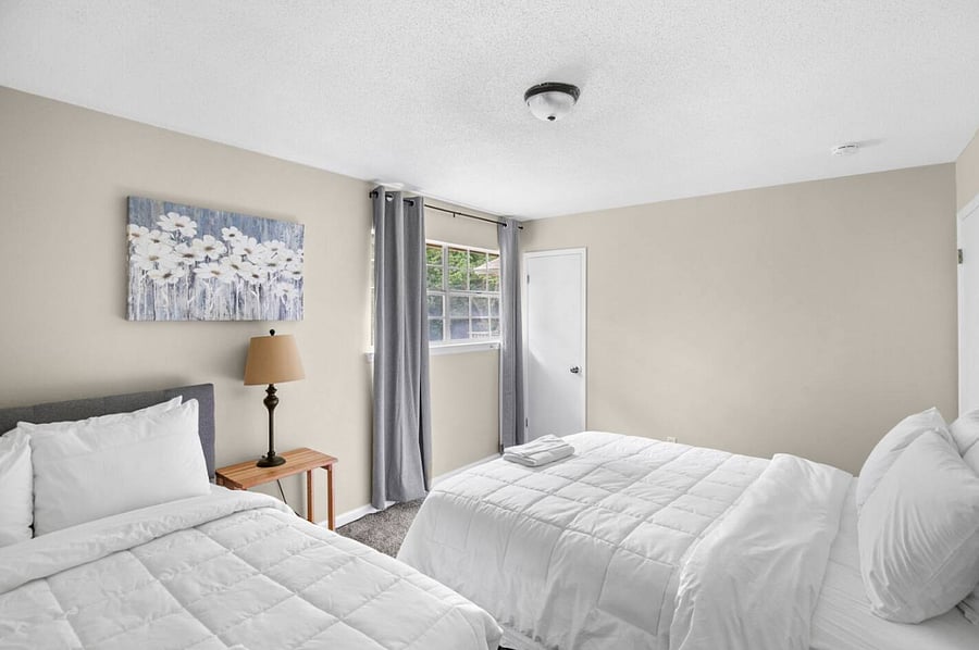 Simple, spacious, and thoughtfully arranged, this room gives guests a place to rest without distraction. With two full beds, it's ideal for sharing while still offering a sense of ease and comfort.